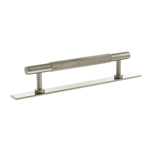 Atlantic Millhouse Brass Eiffel Knurled T-Bar Cabinet Pull Handle on Backplate, 128mm, featuring a textured knurled grip and a sleek design on a rectangular backplate.