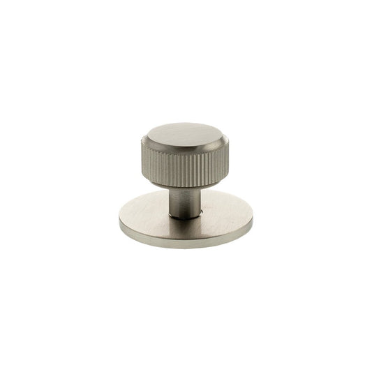 Atlantic Millhouse Brass Battersea Linear Round Cabinet Knob Handle on Backplate in a brushed brass finish, featuring a ribbed design on the knob and a circular backplate for a sleek, modern look.