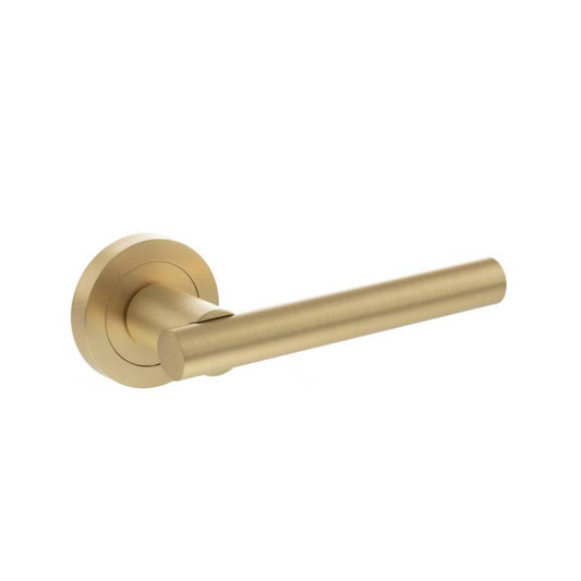 Atlantic STATUS Nebraska Lever Door Handle on Round Rose in a brushed gold finish, featuring a sleek cylindrical handle design mounted on a round rose. The material is likely metal, providing durability and a modern aesthetic.