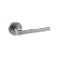 Atlantic STATUS Nebraska Lever Door Handle on Round Rose in a brushed stainless steel finish, featuring a sleek, minimalist design with a cylindrical lever and a rounded backplate.