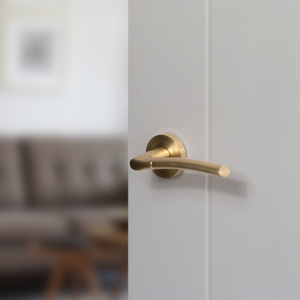 Status Indiana lever on round rose - Satin Brass
