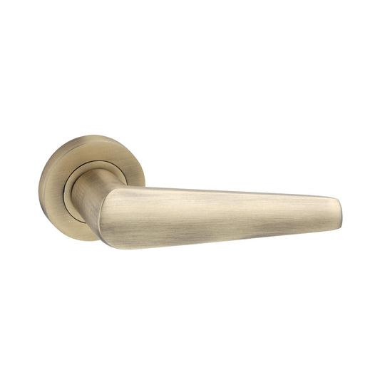 Spira Brass Aero Lever on Rose in a brushed brass finish, featuring a sleek and modern design with a rounded rosette.