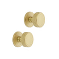 Spira Brass Connaught Knurled Door Knob in a brushed brass finish, featuring a rounded design with a knurled grip texture, shown as a set of two door knobs.