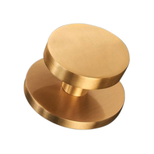 Spira Brass Circle Centre Door Knob in a polished brass finish, featuring a round design with a smooth surface and sturdy base for easy grip.