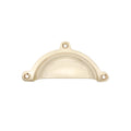 Spira Brass Cottage Cup Pull in a polished brass finish, featuring a curved design and three pre-drilled holes for easy installation. The cup pull is designed for cabinetry or drawers.