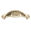 Spira Brass Floral Cup Pull in a polished brass finish, featuring a decorative floral design with two mounting holes for installation.