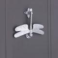 Spira Brass Dragonfly Door Knocker featuring a polished chrome finish, designed with intricate detailing of a dragonfly and mounted on a circular base with a striking design.