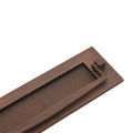 Spira Brass Regency Knocker Postal Plate in a dark bronze finish, measuring 250mm, featuring a simple rectangular shape with a knocker detail on one end.