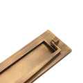 Spira Brass Regency Knocker Postal Plate 250mm in a brushed antique finish, featuring a rectangular shape with a knocker mechanism on the top for easy mail retrieval.