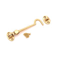 Spira Brass Silent Cabin Hook 4" - 100mm in a polished brass finish, featuring a curved hook and accompanying plate, with screws included.
