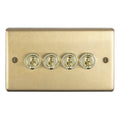 Eurolite Stainless Steel 4 Gang Toggle Switch in satin brass, featuring four toggle switches with circular gold accents and a rectangular backing plate.