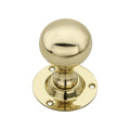 Spira Brass Ball Door Knob in polished brass finish, featuring a round knob design mounted on a matching decorative base with four screw holes for installation.