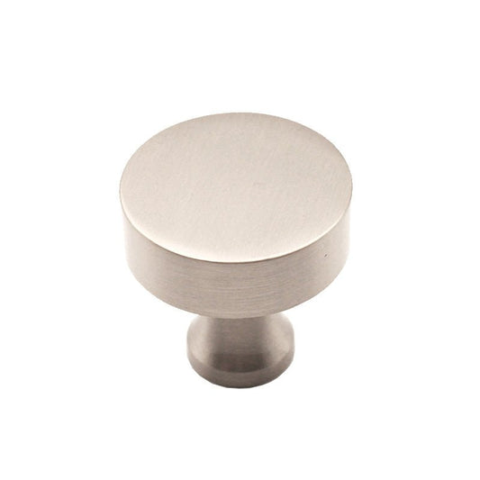 Spira Brass Round Cupboard Knob in a brushed nickel finish, featuring a smooth round design and a petite cylindrical base for mounting.