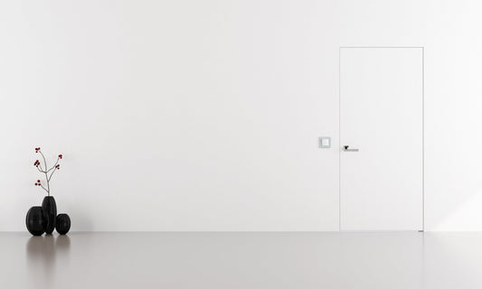 Carlisle Brass Renzo Designer Lever on Sprung Square Rose in a sleek finish, shown on a modern door, complementing a minimalist interior design.