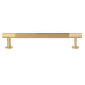 Carlisle Brass Lines Pull Handle Range in a gold finish, featuring a ribbed design for grip, with cylindrical ends for installation. Made of durable metal, this handle adds a sleek touch to cabinets or drawers.