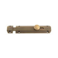 Carlisle Brass Surface Bolt in an oil-rubbed bronze finish, featuring a round knob for easy operation and a streamlined design suitable for securing doors.