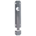 Carlisle Brass Surface Bolt in a satin finish, featuring a smooth round knob and elongated rectangular body, designed for secure fastening. Made from durable metal, it is suitable for various door applications.