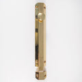 Carlisle Brass Surface Bolt in polished brass, featuring a cylindrical knob and a long rectangular body with visible screw holes for secure installation.