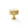Alexander & Wilks Lucia Knurled Cupboard Knob in brushed gold, featuring a round top and textured knurled detailing on the sides for grip.