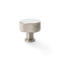 Alexander & Wilks Lucia Knurled Cupboard Knob in a brushed nickel finish, featuring a round top with a textured knurled design and a sturdy base for attachment.