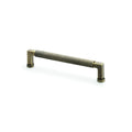 Alexander & Wilks Camille Knurled Cupboard Pull Handle in aged brass, featuring a textured grip and two cylindrical bases, designed for cabinet doors and drawers.