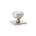 Alexander & Wilks Quantock Cupboard Knob on Square Backplate in satin nickel finish, featuring a round knob shape with a square backplate and smooth surface.