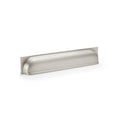 Alexander & Wilks Quantock Cup Handle in satin nickel, featuring a streamlined, curved design with a smooth finish, suitable for cabinet or drawer installations.