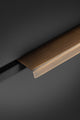 Alexander & Wilks Tilly Finger Pull in a brushed bronze finish, featuring a sleek design with a flat top and a slight edge, suitable for modern cabinetry.