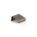 Alexander & Wilks Tilly Finger Pull in aged brass finish, featuring a sleek, minimalist design with a single mounting hole for easy installation.