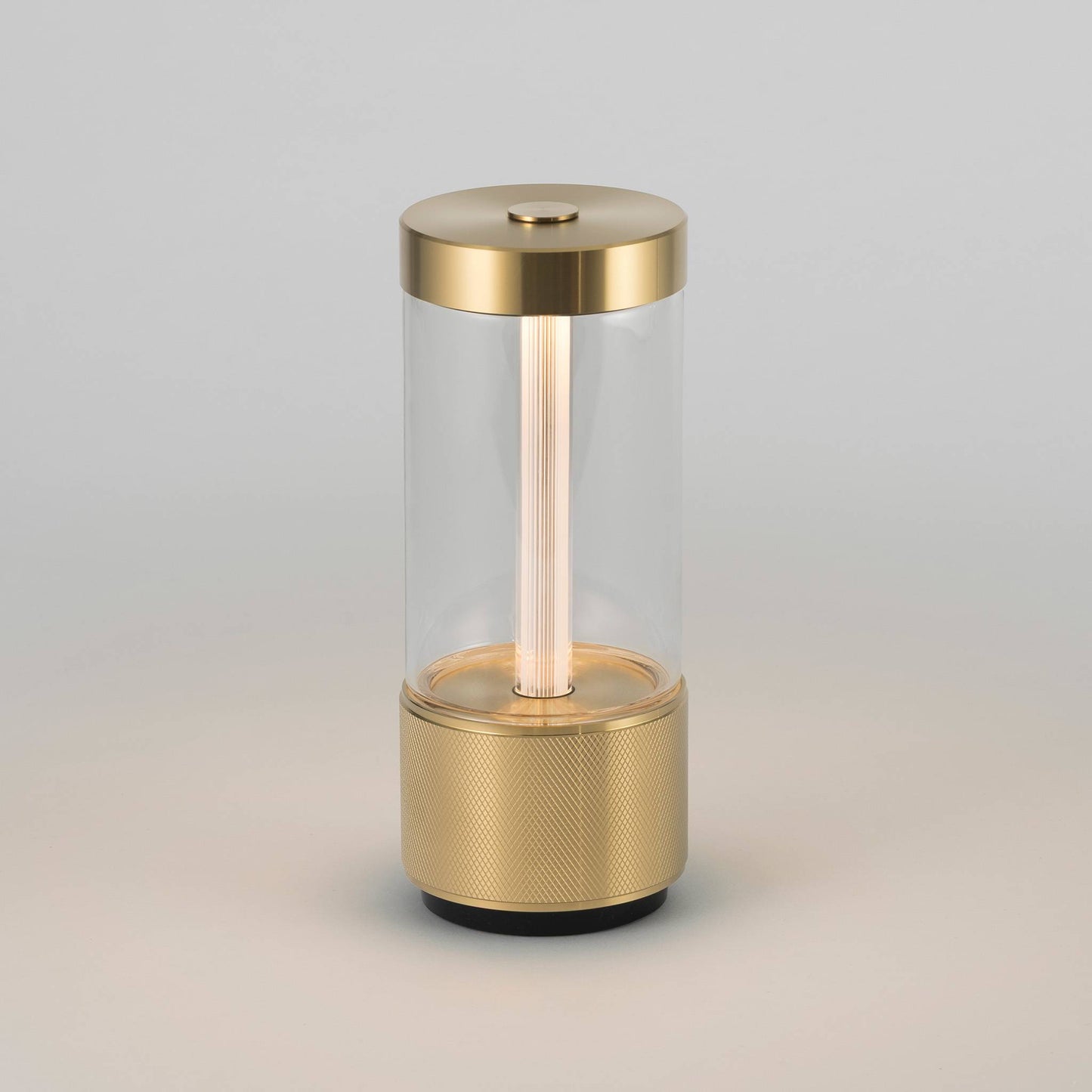 Buster + Punch Takeout portable table light in Brass, lit