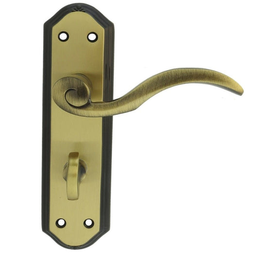 Carlisle Brass Wentworth Lever on Backplate in an antique brass finish, featuring a decorative curved lever and a keyhole, mounted on a rectangular backplate with rounded edges.