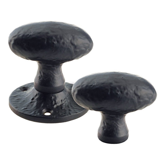 Zoo Hardware Oval Rim Knob - 2.5" in a textured black finish, made of metal, shown as a set of two with an un-sprung design and a round base for installation.