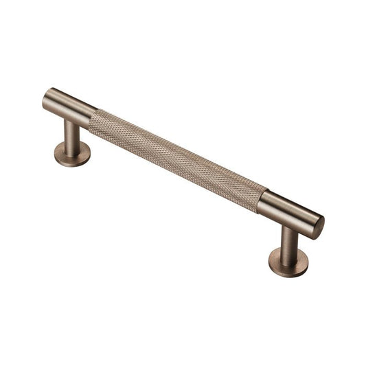 Carlisle Brass Knurled Pull Handle in a brushed bronze finish, featuring a textured grip and rounded ends for secure installation.