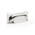 Alexander & Wilks Quantock Cup Handle in polished chrome finish, featuring a curved design and rectangular back plate, suitable for cabinetry and furniture.