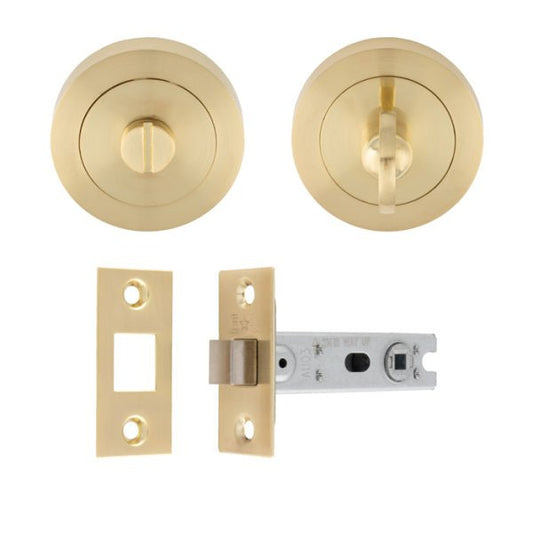 Carlisle Brass UDP Bathroom Pack in polished brass, featuring two round doorknobs, one with a thumb turn and one with a push button, along with a striker plate and a latch mechanism.