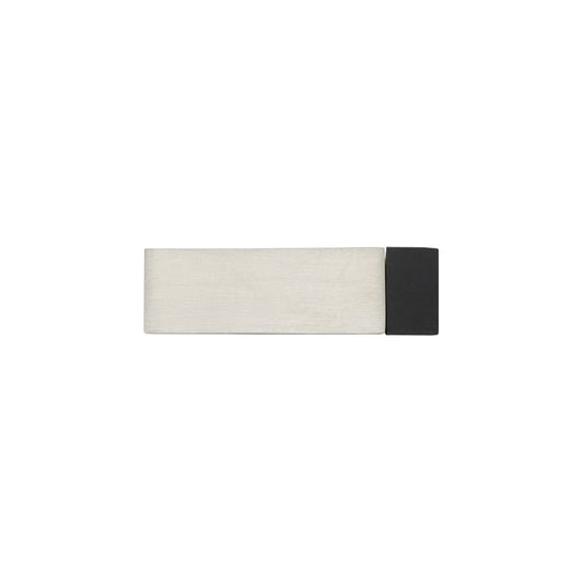 Zoo Hardware Square Door Stop, 65mm in a brushed stainless steel finish with a black rubber base. The design features a rectangular shape for stability.