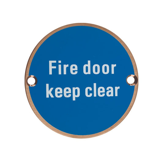 Zoo Hardware Fire Door Keep Clear Sign in blue with white lettering, featuring a circular design and two mounting holes.