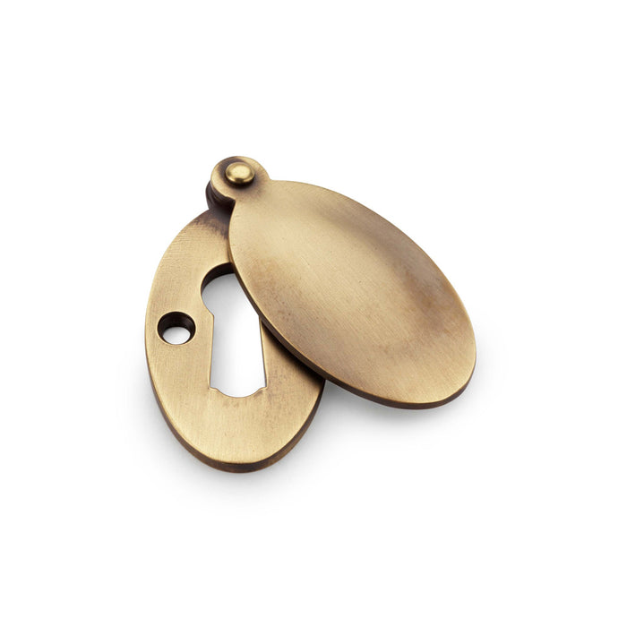 Alexander & Wilks Standard Key Profile Ellipse Escutcheon with Harris Design Cover - Antique Brass